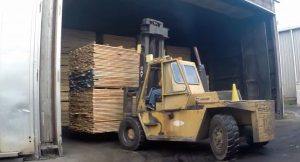 Kiln dried lumber being moved to the manufacturing floor.